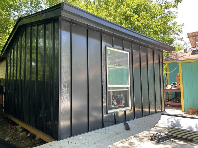 Black standing seam metal wall panels for Roof Inspection in Murray