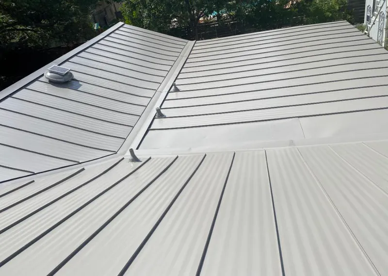 Solar attic fan installed on a metal roof for Roof Ventilation in Murray